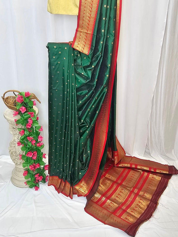Green Soft-Silk Gadwal Saree with Copper Zari Peacock Border & Rich Pallu – Wedding & Festive Wear