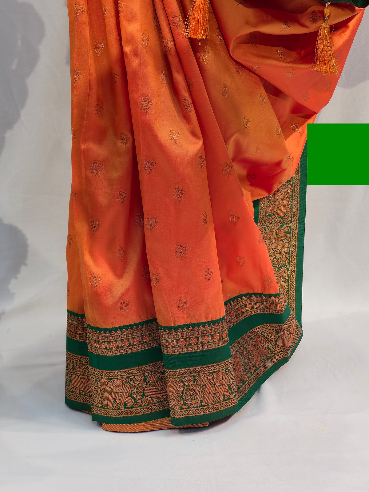 Saffron Soft Silk Saree with Flower Butti & Hatti Border