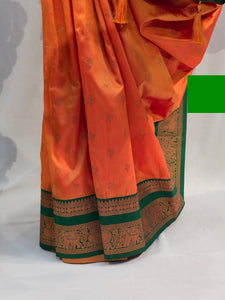 Saffron Soft Silk Saree with Flower Butti & Hatti Border
